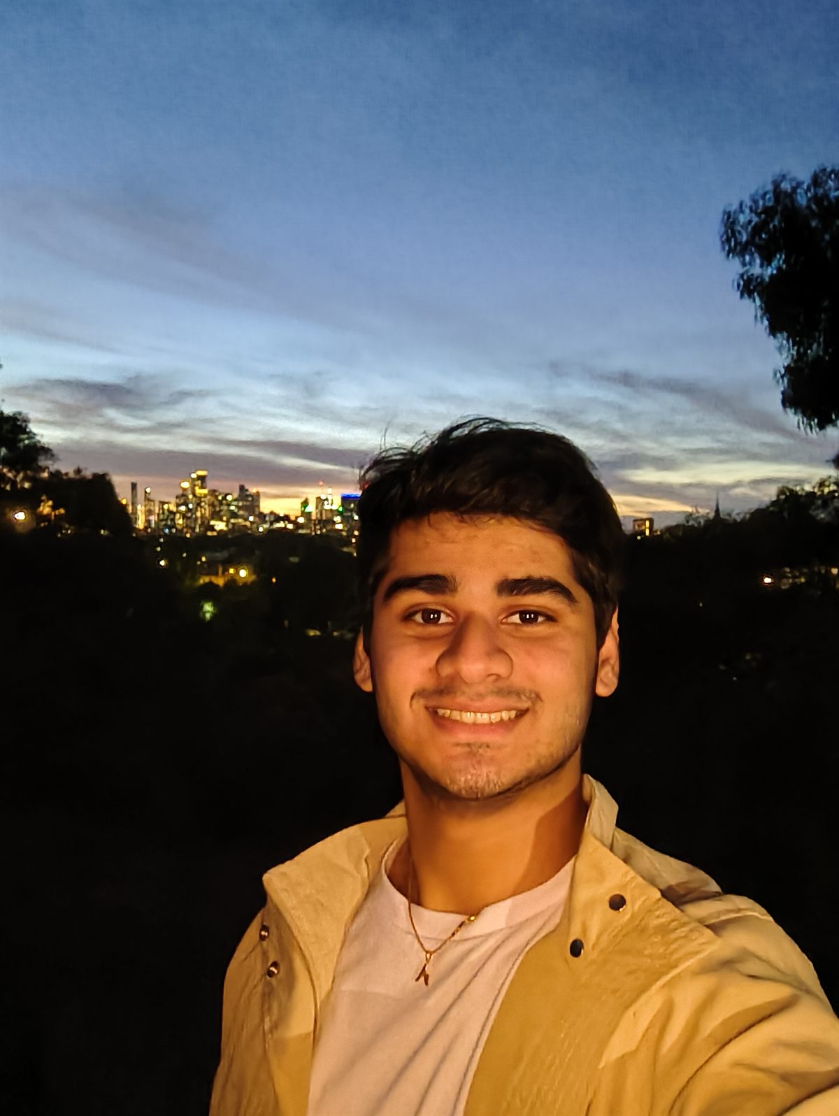 Ashank Sundaram in front of the Melbourne skyline at dusk
